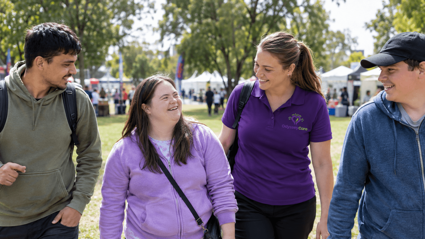 OdysseyCare team member and participant walking together outdoors